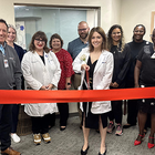 Kalee Woody ribbon cutting